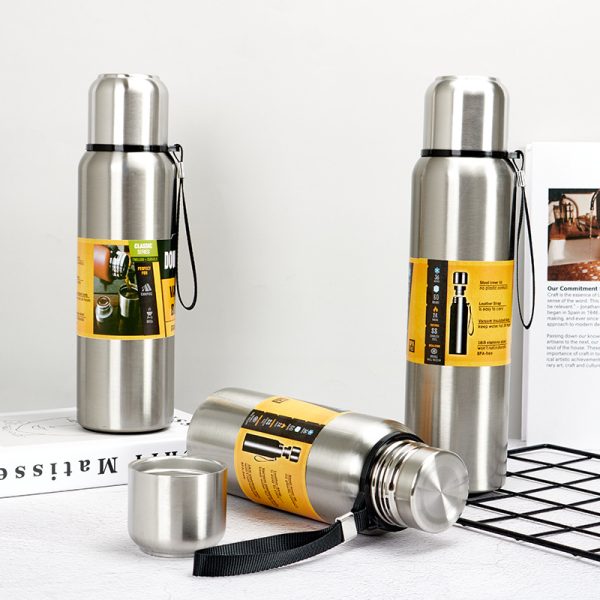 All stainless steel water bottles with a cup lip and rope handle